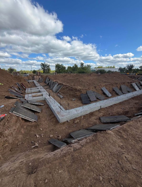Concrete footings formed and poured at the Golden Spike Road site